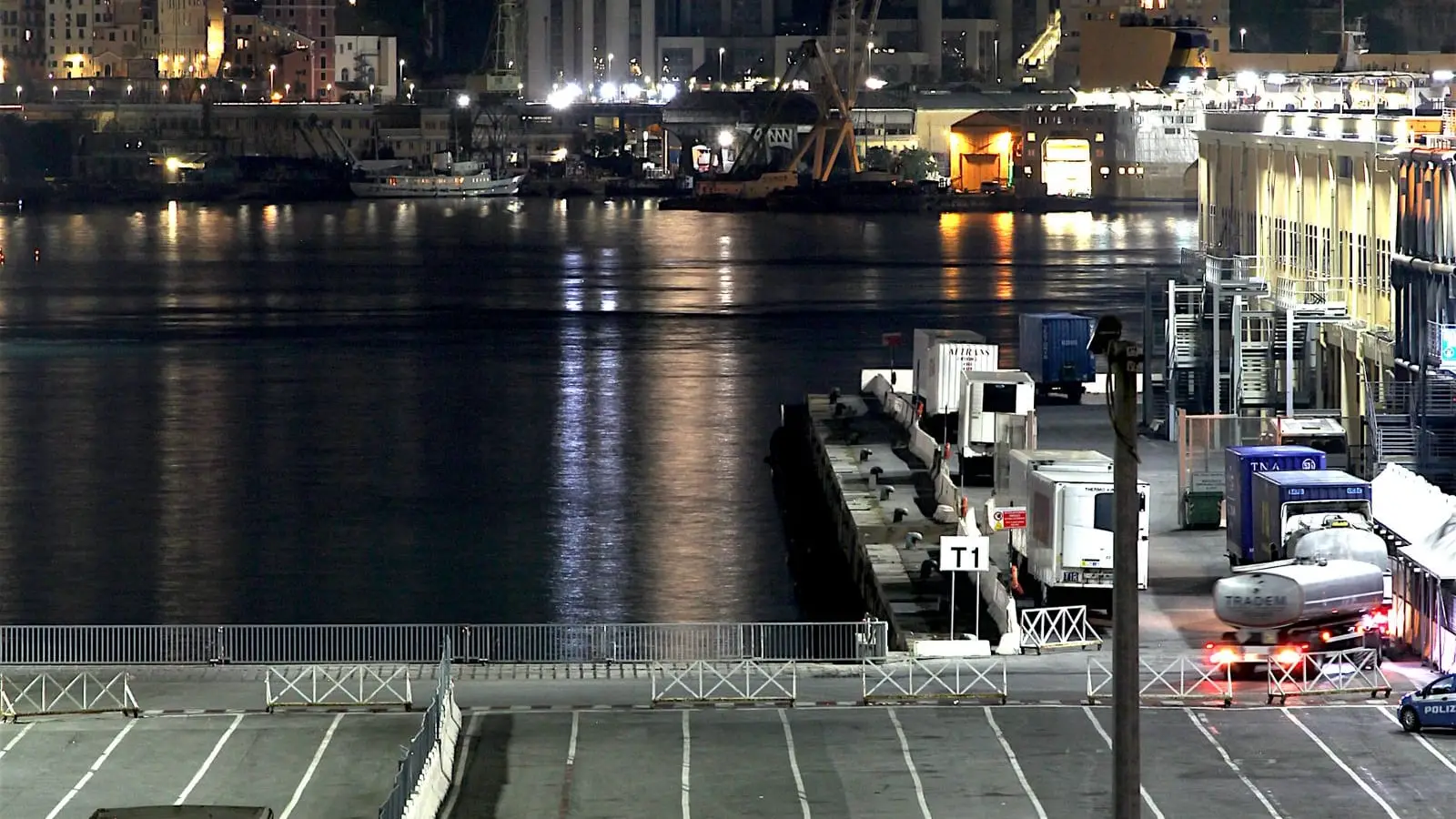 The concrete dock at the port of Genoa, Italy, lit at night