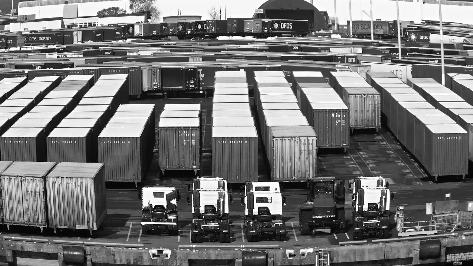 Containers massed across a port yard beside the berths